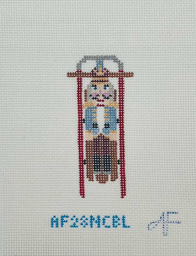 Anne Fisher Sled with Blue Nutcracker Ornament