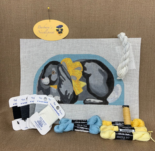 Black and Gray Bunny with Yellow Bow and Still Water Background